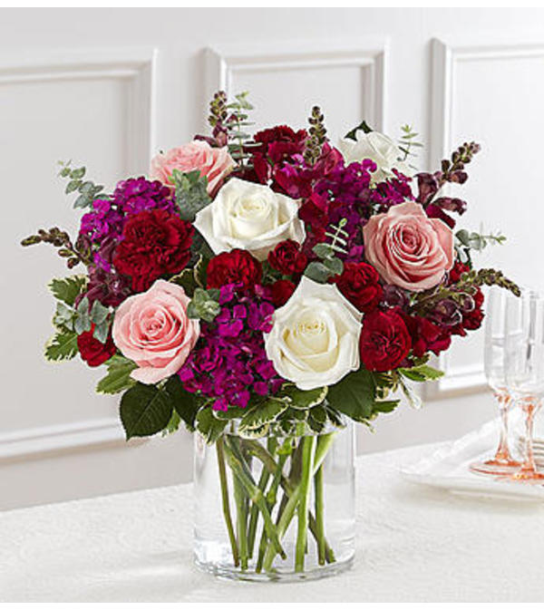 romantic valentines day flowers with eucalyptus and roses in clear vase 
